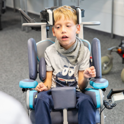 Young boy using the CoMoveIT Smart system